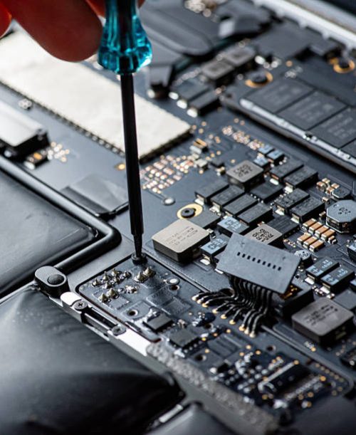 close up of Technician repairing electronic circuit board, Rpairing the motherboard with a vacuum cleanere